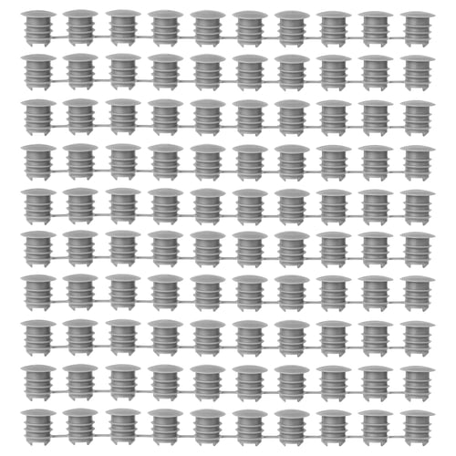 Grid of grey KOMPLEMENT polyethylene plastic cover caps, uniformly arranged, cylindrical shape with ridged design.