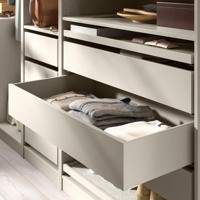 Organised drawer in white KOMPLEMENT system holds neatly folded clothes.