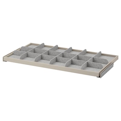 A white KOMPLEMENT drawer organiser with fabric dividers for tidy storage.