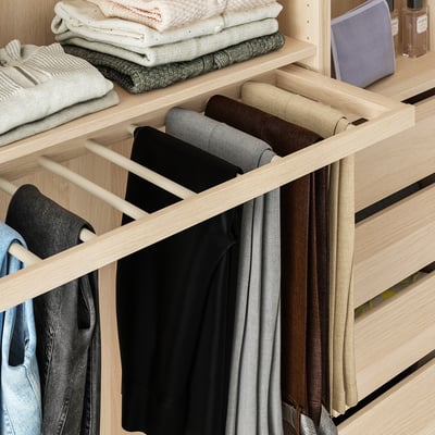 Closet with rolled pants organizer and hanging sections. Zentrums of pants visible, efficient use of space.