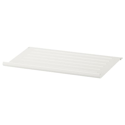 KOMPLEMENT slanted metal shoe shelf with contoured edge.