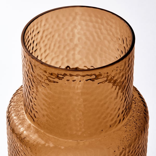Amber glass vase. Mouth-blown, textured surface. Tall, slim neck. Unique, recycled material.
