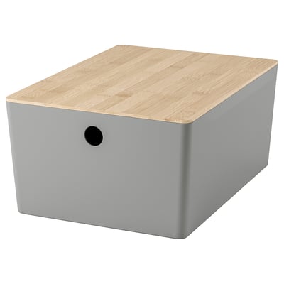 KUGGIS: gray box with wooden lid, round handle, stores items, stacks neatly.