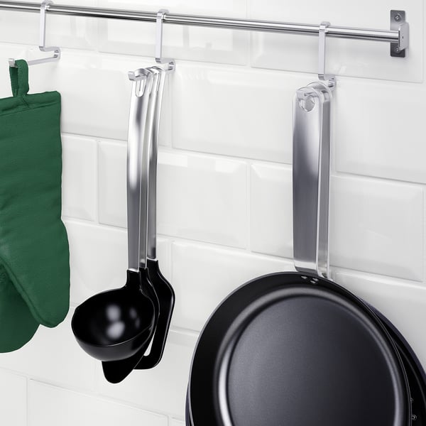 Wall-mounted kitchen storage with a hanging ladle and frying pan, part of the KUNGSFORS series.