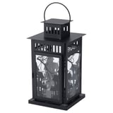Black KUSTFYR lantern, haunted design, metal & glass, for halloween.