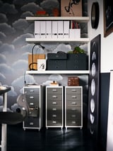 Home office with shelves, plant, decor, filing cabinets