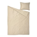Beige bedding set: duvet and pillow, smooth lyocell, simple design.
