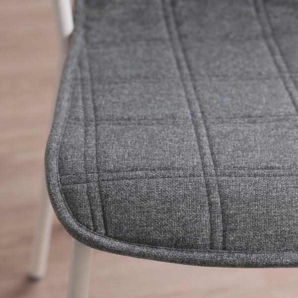 Close-up of LÄKTARE chair seat, showing soft, durable fabric with detailed stitching, highlighting quality and comfort.
