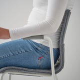 Person sitting in white LÄKTARE office chair with lumbar support and armrests.