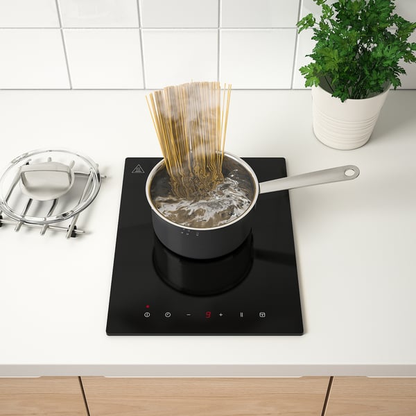 Spaghetti boiling on induction hob.