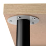 Close-up of modern table leg and metal base join, showcasing sturdy, sleek design.