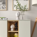 Modern white cabinet with open & closed storage, displaying items, push-openers, adjustable shelves, cable management