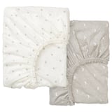 Two light-colored fitted sheets with dot patterns, one white and one gray, folded neatly.