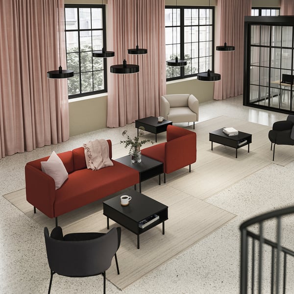 Modern living room with red LILLEHEM sofa, black coffee tables, and black pendant lamps.