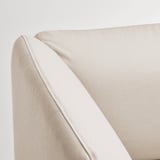Close-up of high-quality beige sofa with smooth, durable fabric and clean stitching.