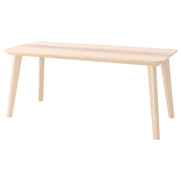 A LISABO light wood dining table with a natural finish and rectangular shape, supported by sturdy tapering legs.