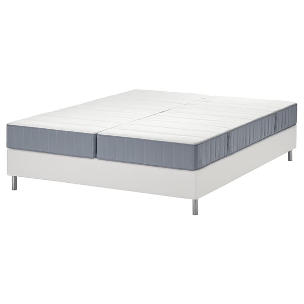 Two white mattresses on a white bed frame, light grey edges.
