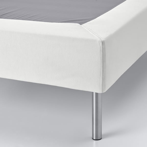Modern bed base with sleek, supportive design and metal legs, shown in pristine white.