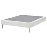 White LYNGÖR bed base, elevated on metal legs, flat slats, light gray interior, minimalist design.