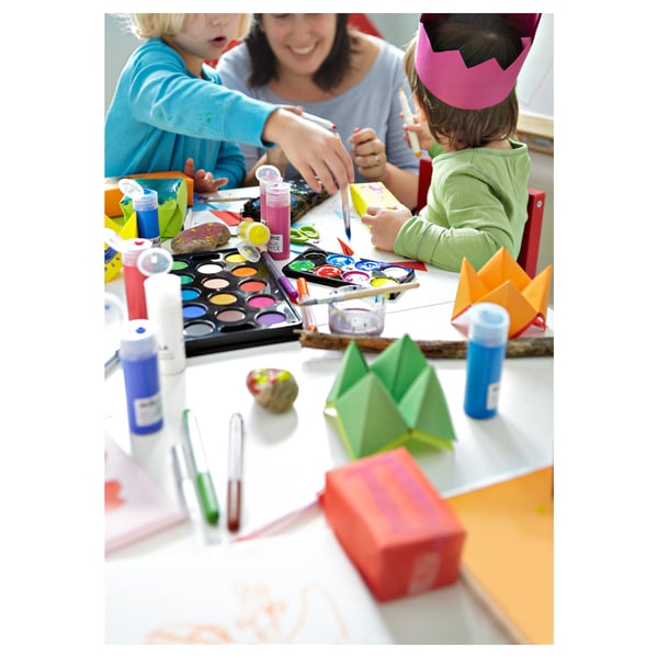 Kids crafting with paints & origami under adults guidance.