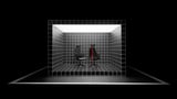 Black gaming chair with red accents, electronic design.