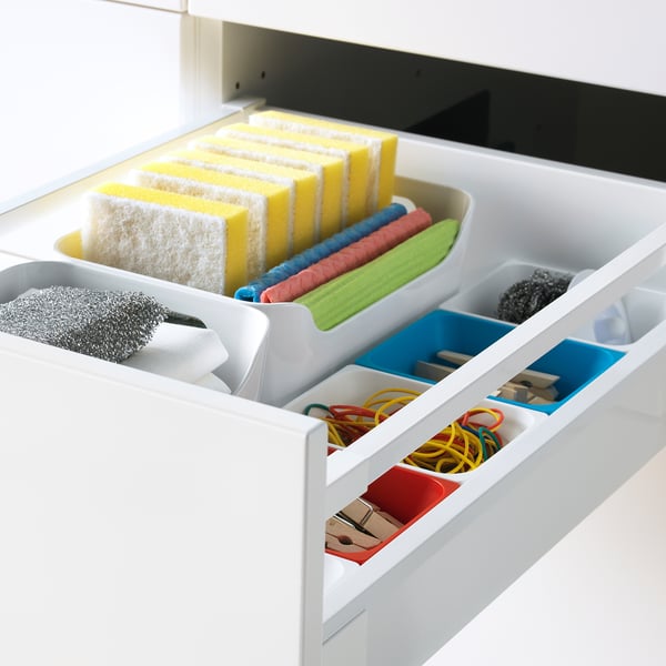 Organized drawer with sponges, cloths, and tools, featuring maximized access and quiet close.