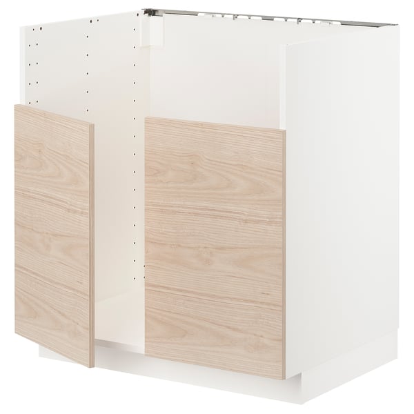 White METOD kitchen unit with light wood doors.