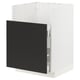A modern kitchen cabinet in white with a black door.