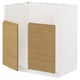 White METOD kitchen unit with oak-effect doors.