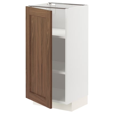 A METOD kitchen cabinet with a walnut brown door and white body. It has a rectangular shape and flexible shelving inside.