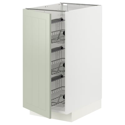 A METOD kitchen cabinet in green with organized interior shelves.