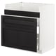 An open METOD kitchen cabinet with black-stained ash wood fronts, featuring three drawers.