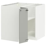 A white METOD kitchen cabinet set with a light grey door, featuring a modern, clean design.