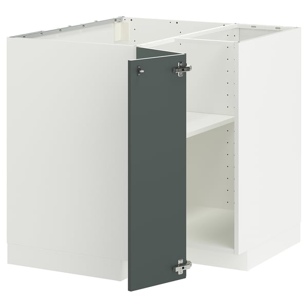 A white METOD kitchen cabinet with a grey-green door and adjustable shelves.