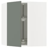 Modular kitchen unit with grey-green door open, showing shelves.