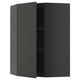 Black METOD wall cabinet with two adjustable shelves and reversible door.