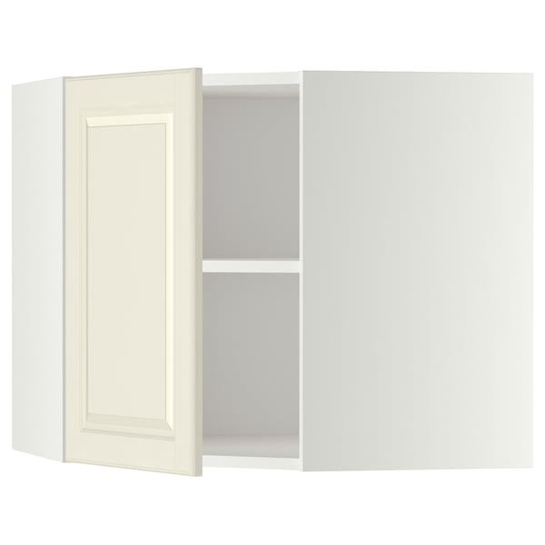 A METOD corner kitchen cabinet in off-white with an adjustable shelf and reversible door. Traditional design, sturdy construction.