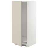 A beige METOD cabinet from ikea. Its a tall, rectangular unit designed for a fridge or oven, featuring a smooth, clean look with adjustable shelving.