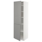 A tall white METOD kitchen cabinet with light grey doors and shelves. It has a classic design with adjustable shelves and bevelled edges on the doors.