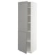 A tall white METOD kitchen cabinet with light grey doors and shelves. It has a classic design with adjustable shelves and bevelled edges on the doors.