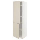 A white METOD kitchen cabinet with beige doors and shelves. The cabinet has a modern, smooth design with adjustable inner shelves.