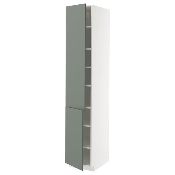 A tall, white METOD kitchen cabinet with green-gray nickeby doors and adjustable shelves.