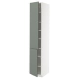 A tall, white METOD kitchen cabinet with green-gray nickeby doors and adjustable shelves.