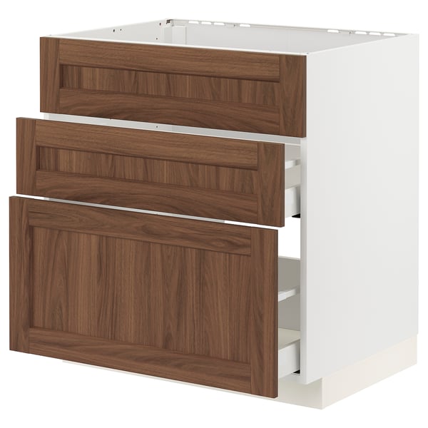 White and wood kitchen cabinet with three drawers and frame.