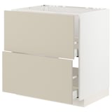 An off-white METOD kitchen cabinet with beige havstorp fronts, featuring a smooth, rectangular design with integrated drawers.