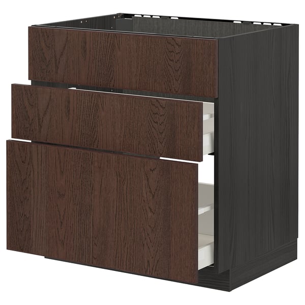 Dark brown METOD kitchen unit with three wooden drawers, sleek and modern design.