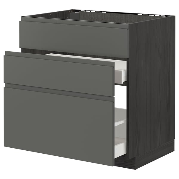 Modern dark grey kitchen cabinet with three drawers. Sleek, flat surfaces and minimalist design for organized storage.