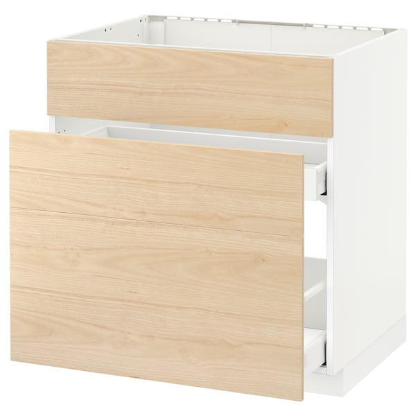 A white ikea METOD kitchen cabinet with light ash drawers, designed for a built-in oven or sink. It smooth-running drawers with an open design.