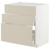 White METOD kitchen unit with beige drawers and smooth design.