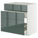 Modern kitchen unit, grey-green high-gloss drawer fronts, self-closing drawers, white frame.
